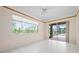 Bonus room with tile floors, wood trim, recessed lights, and access to the screened lanai and pool at 8312 Misty Lake Cir, Sarasota, FL 34241
