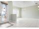 Welcoming foyer featuring a decorative door and tile flooring at 8312 Misty Lake Cir, Sarasota, FL 34241