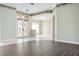 Beautiful foyer with decorative glass doors, neutral paint, and hardwood flooring at 8312 Misty Lake Cir, Sarasota, FL 34241