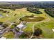 Aerial view of a lush golf course with well-manicured greens and mature trees at 8312 Misty Lake Cir, Sarasota, FL 34241