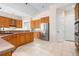 Bright, open kitchen featuring stainless steel appliances and abundant wood cabinetry at 8312 Misty Lake Cir, Sarasota, FL 34241