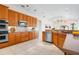 Spacious kitchen with modern appliances, ample cabinet space, and stylish tile flooring at 8312 Misty Lake Cir, Sarasota, FL 34241