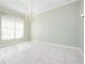 Bright living area with tile floors and a chandelier at 8312 Misty Lake Cir, Sarasota, FL 34241