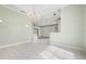 Spacious living area showcasing an open layout with tile flooring and a chandelier at 8312 Misty Lake Cir, Sarasota, FL 34241