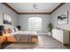 Serene main bedroom with neutral tones, large window, and minimalist decor for relaxation at 8312 Misty Lake Cir, Sarasota, FL 34241