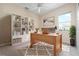 Well-lit office with a large window and a built-in bookcase at 8312 Misty Lake Cir, Sarasota, FL 34241