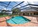 Screened pool and jacuzzi with brick patio; ideal for outdoor relaxation at 8312 Misty Lake Cir, Sarasota, FL 34241
