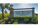 Promenade East at Palmer Ranch community sign set amongst tropical landscaping at 8557 Milestone Dr, Sarasota, FL 34238