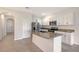 Well-lit kitchen features stainless steel appliances, granite countertops, and white cabinetry at 8557 Milestone Dr, Sarasota, FL 34238