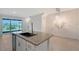 Eat-in kitchen with an island, a stainless steel dishwasher, and sliding glass doors to a patio at 8557 Milestone Dr, Sarasota, FL 34238