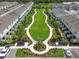 Aerial view of the community featuring landscaping and new construction townhomes at 8733 Winter Breeze Way, Sarasota, FL 34241