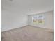 Spacious bedroom with neutral carpet and dual windows with views at 8733 Winter Breeze Way, Sarasota, FL 34241