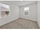 Bright bedroom featuring natural light from two windows and neutral carpet at 8733 Winter Breeze Way, Sarasota, FL 34241