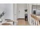 Bright entryway featuring tile floors and access to both the kitchen and stairway at 8733 Winter Breeze Way, Sarasota, FL 34241