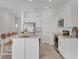 Bright and airy kitchen featuring stainless steel appliances, bar seating, and plenty of storage at 8733 Winter Breeze Way, Sarasota, FL 34241