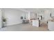 Open-concept kitchen and dining area, featuring an island and stainless steel appliances at 8733 Winter Breeze Way, Sarasota, FL 34241