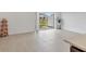 Bright living room with tile floors and sliding glass doors to the outdoor patio at 8733 Winter Breeze Way, Sarasota, FL 34241