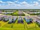 Beautiful aerial view of homes with spacious backyards and covered patios in a quiet neighborhood at 9040 Tequila Sunrise Dr, Sarasota, FL 34241