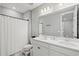Bright bathroom featuring double sinks, modern fixtures and a shower at 9040 Tequila Sunrise Dr, Sarasota, FL 34241