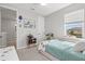 Cozy bedroom with a comfy bed, side table, and ample natural light at 9040 Tequila Sunrise Dr, Sarasota, FL 34241
