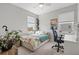Inviting bedroom with natural light, plant accents, and a comfortable bed at 9040 Tequila Sunrise Dr, Sarasota, FL 34241