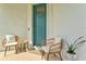 Cozy front porch with comfortable seating, creating a welcoming entrance to the home at 9040 Tequila Sunrise Dr, Sarasota, FL 34241