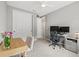 Well-lit home office with desk space, storage, and view to the hallway at 9040 Tequila Sunrise Dr, Sarasota, FL 34241