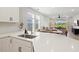 Open kitchen area with a view of the living and dining spaces, creating a seamless flow at 9040 Tequila Sunrise Dr, Sarasota, FL 34241