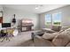 Bright living room featuring a comfortable sofa, entertainment center and window with pleasant views at 9040 Tequila Sunrise Dr, Sarasota, FL 34241