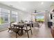 Bright and airy living room with dining area, plenty of natural light, and patio access at 9040 Tequila Sunrise Dr, Sarasota, FL 34241