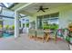 The expansive patio offers a ceiling fan and lots of comfy seating for relaxing outside at 9040 Tequila Sunrise Dr, Sarasota, FL 34241