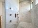 Modern bathroom features stylish marble tile, gray mosaic floor, and sleek bronze fixtures at 1167 Boundary Blvd, Rotonda West, FL 33947