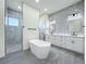 Luxurious bathroom featuring a soaking tub, double vanity with marble countertops, and a walk-in shower at 1167 Boundary Blvd, Rotonda West, FL 33947