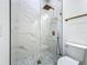 Bathroom featuring a glass shower, a tiled floor, and modern copper fixtures at 1167 Boundary Blvd, Rotonda West, FL 33947