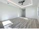 Spacious bedroom featuring a ceiling fan and a doorway leading to another room at 1167 Boundary Blvd, Rotonda West, FL 33947