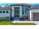 Charming single-story house featuring stone accents, a three-car garage, and well-maintained landscaping at 1167 Boundary Blvd, Rotonda West, FL 33947