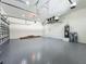Spacious three-car garage with epoxy flooring and plenty of storage space at 1167 Boundary Blvd, Rotonda West, FL 33947