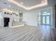 Bright, open-concept kitchen with modern white cabinetry, marble countertops, and stainless steel appliances at 1167 Boundary Blvd, Rotonda West, FL 33947