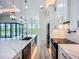 Open kitchen features an island, modern appliances, and an eat-in breakfast bar at 1167 Boundary Blvd, Rotonda West, FL 33947