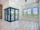 Bright living space featuring sliding glass doors overlooking the lanai and backyard with a pool at 1167 Boundary Blvd, Rotonda West, FL 33947