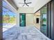 An open patio with views to a pool and other parts of the interior at 1167 Boundary Blvd, Rotonda West, FL 33947