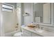 Cozy bathroom with tub and shower combination and vanity with marble countertop at 13220 Swiftwater Way, Lakewood Ranch, FL 34211