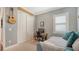Cozy bedroom with a daybed, wooden desk, and ample closet space at 13220 Swiftwater Way, Lakewood Ranch, FL 34211