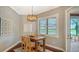 Dining area has a wooden table and chairs near the windows at 13220 Swiftwater Way, Lakewood Ranch, FL 34211