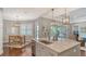 Open concept kitchen features a large island and a dining area at 13220 Swiftwater Way, Lakewood Ranch, FL 34211