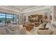 Relaxing living room featuring water views and sliding glass doors at 13220 Swiftwater Way, Lakewood Ranch, FL 34211