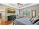 Spacious main bedroom with a ceiling fan, windows, and dresser at 13220 Swiftwater Way, Lakewood Ranch, FL 34211