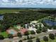 Overhead view showcasing community amenities: pool, tennis court, playground, and green spaces at 13503 22Nd E Ct, Parrish, FL 34219