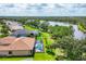 Aerial view of neighborhood showing mature trees, landscaping, and waterfront properties at 13503 22Nd E Ct, Parrish, FL 34219