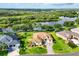 Beautifully landscaped home situated on a picturesque lot with serene water views and lush greenery at 13503 22Nd E Ct, Parrish, FL 34219